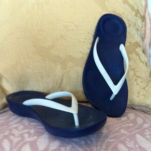 Never worn Navy blue and white flip flops